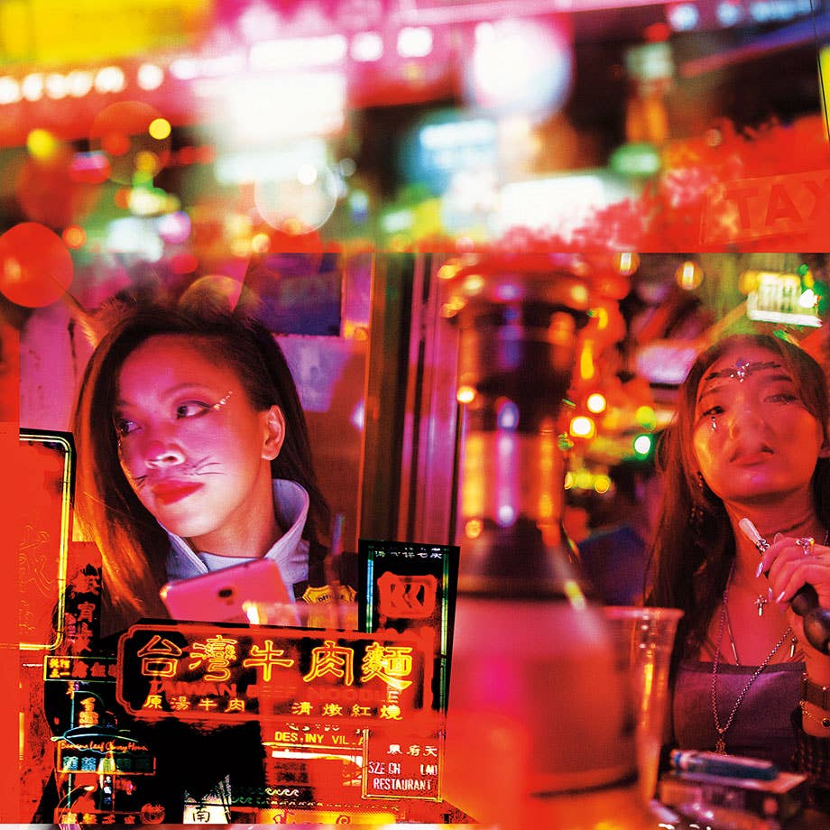 Women smoking on the table with neon lights in the background